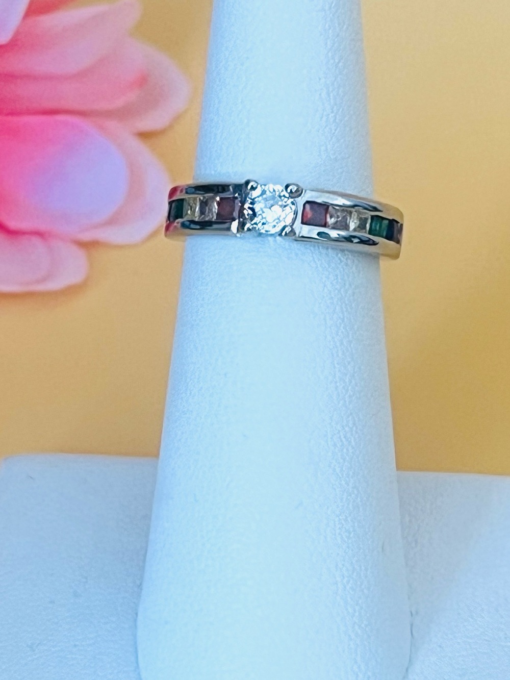 Silver .925 solitaire ring with multi color CZ on each size, stamped